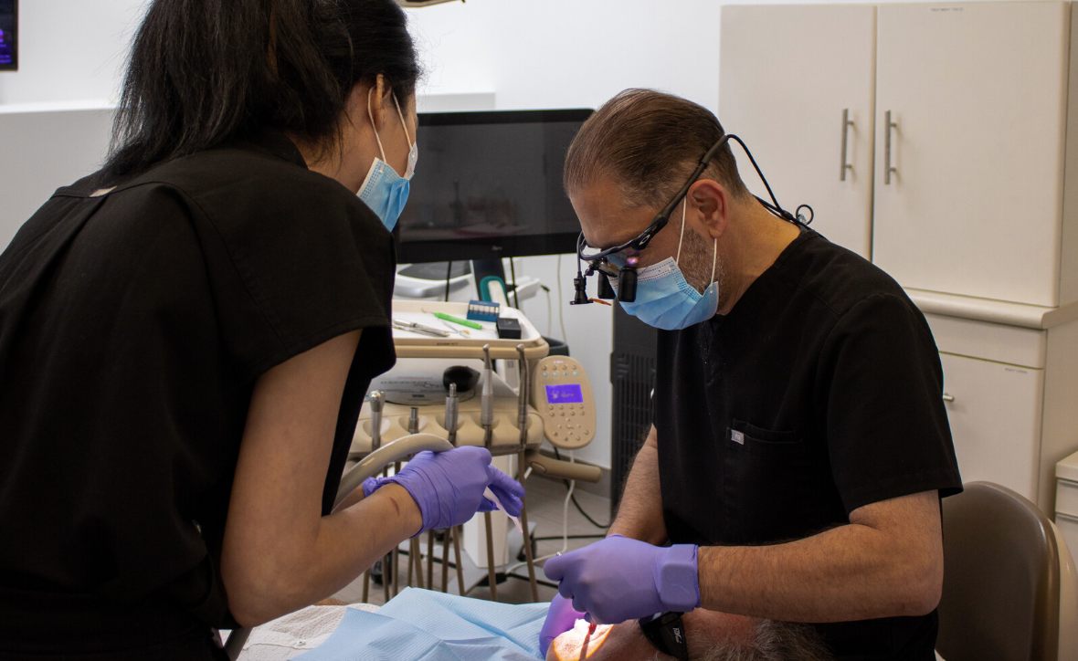 Dentist performing implant-focused treatment in the Yorkville clinic
